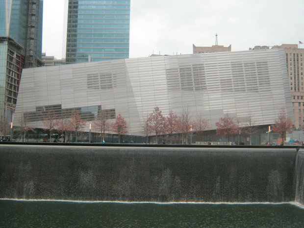 The 9/11 Museum by Snohetta with a memorial waterfall in the foreground
